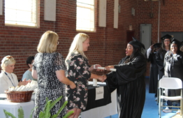 Inmate receiving her diploma.